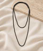 Collier sautoir multi-position en spinelle gris à perles facettées