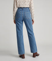 Jean Bouta bleu jean wide leg à taille haute et boutons dorés porté de dos — Carnaby