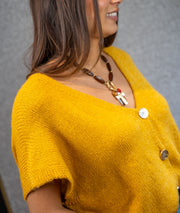 Gilet manches courtes en maille ocre côté