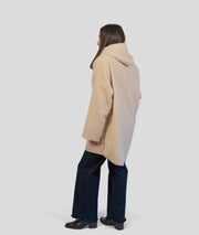 Manteau en bouclettes beige coté