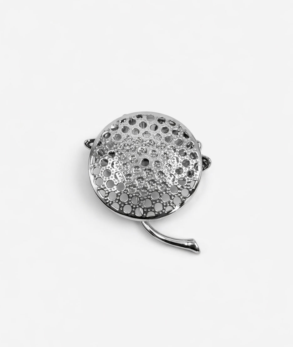 Broche fleur à strass argentée dos