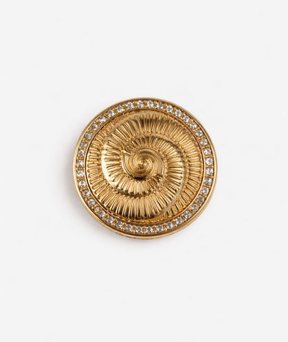 Broche dorée à strass Spirale face