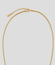 Collier Trèfle doré sautoir avec pendentif noir et franges — marque Carnaby