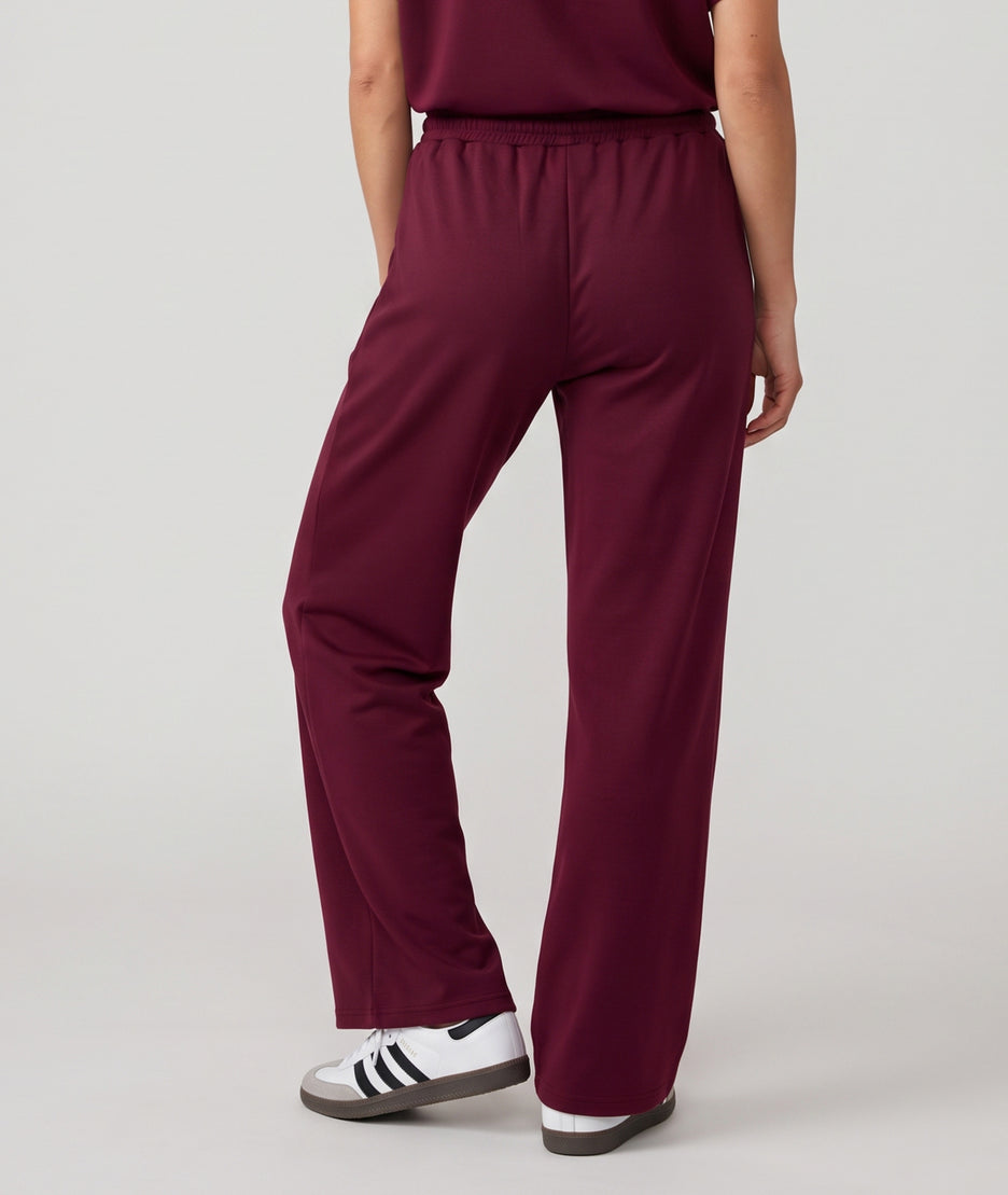 Pantalon jogging femme Spalo large bordeau avec taille élastique et liens à nouer