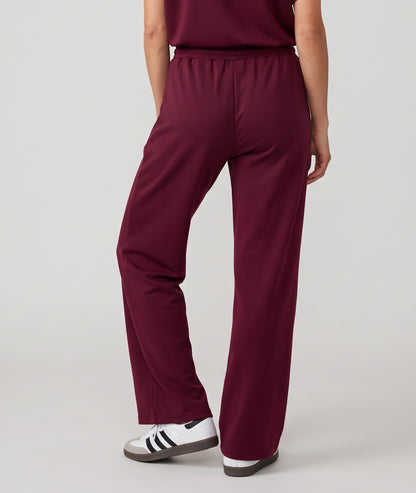 Pantalon jogging femme Spalo large bordeau avec taille élastique et liens à nouer