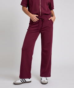 Pantalon jogging femme Spalo large bordeau avec taille élastique et liens à nouer